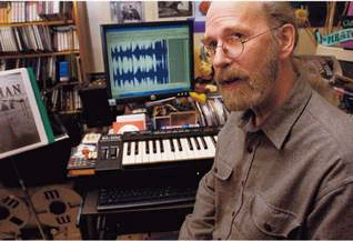 Randy Bowser is shown composing music.